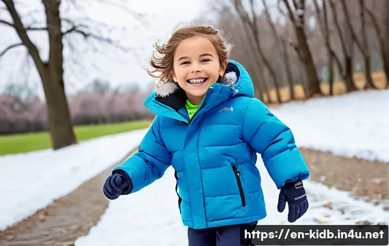 갭키즈와 자라키즈 겨울 아우터 - A cheerful child wearing a bright, reversible winter jacket made of water-resistant fabric with synt...